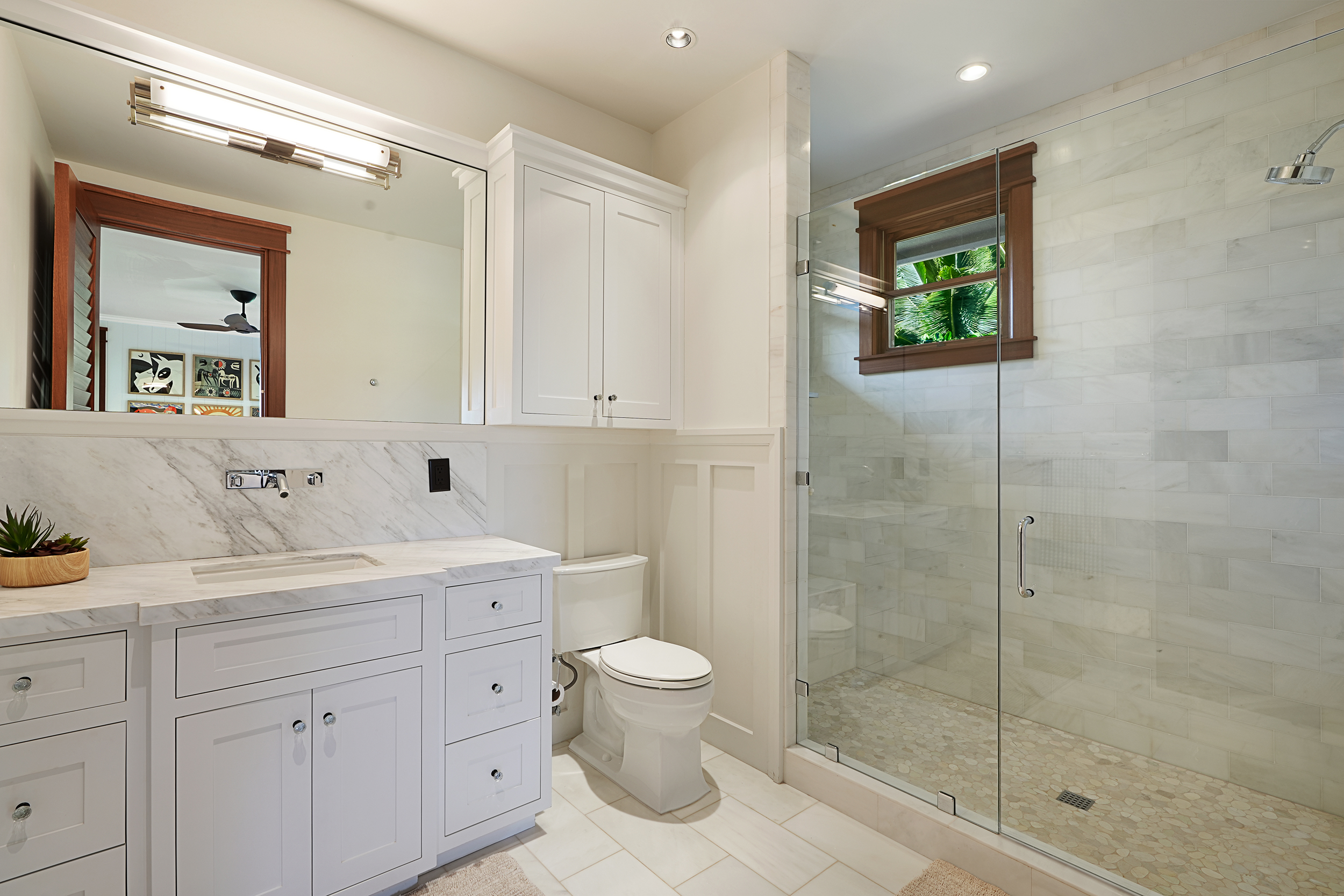 2332 Makana Ano Place Kilauea, HI 96754 - Photo 11 of 12 a bathroom with a granite countertop sink a toilet a mirror and shower