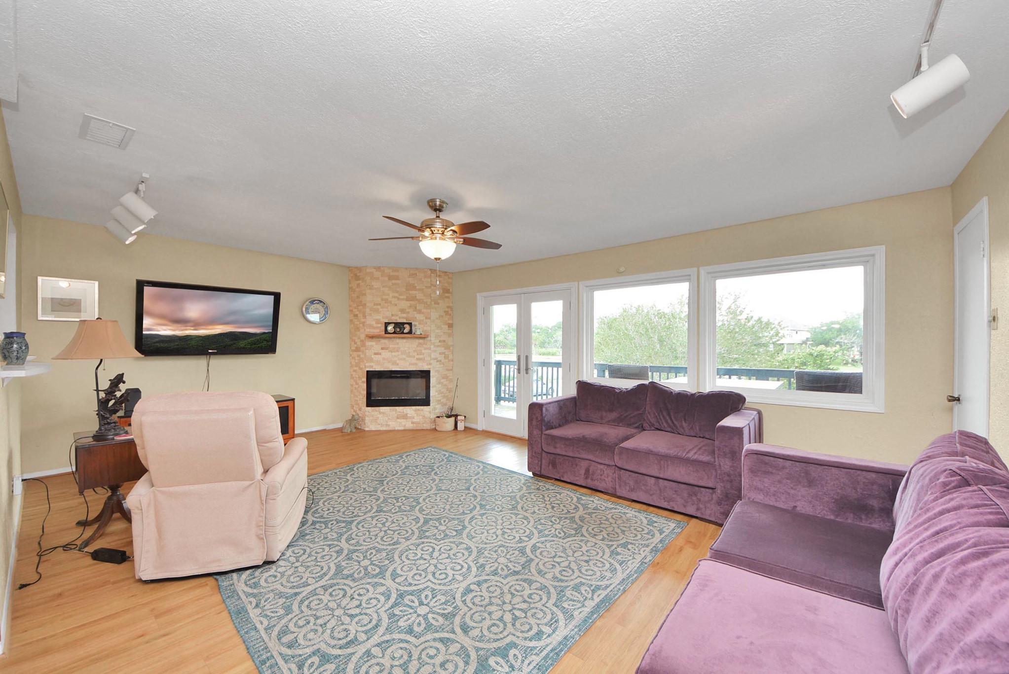 2117 Casa Rio Circle Dickinson, TX 77539 - Photo 12 of 23 a living room with furniture large window and a flat screen tv