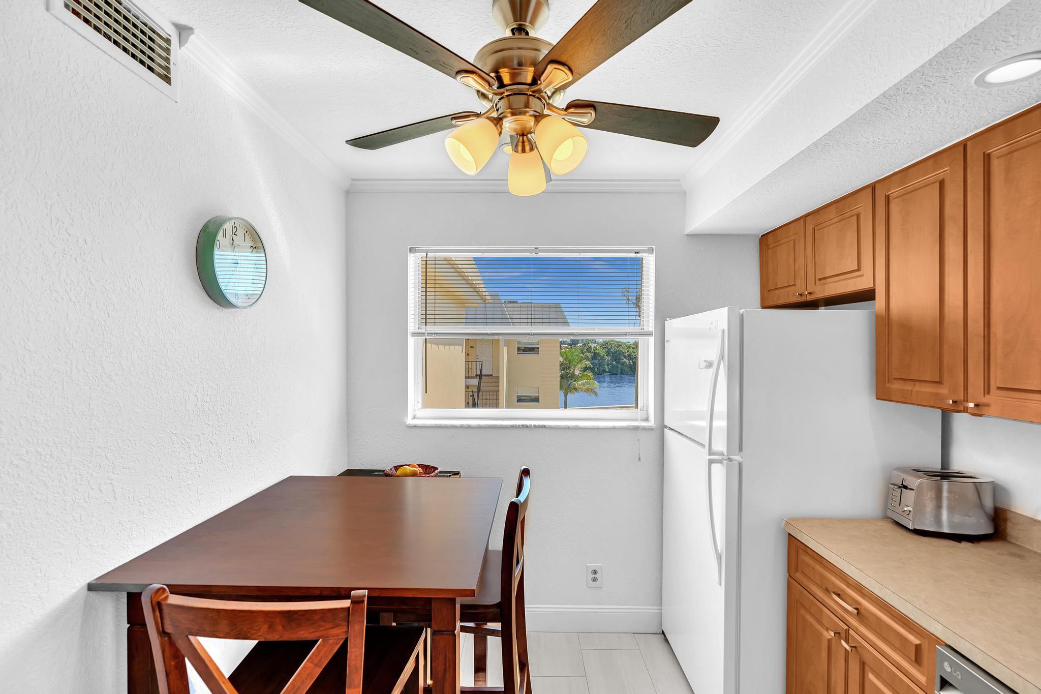 3 Colonial Club Drive, Unit 300 Boynton Beach, FL 33435 - Photo 11 of 71 a kitchen with stainless steel appliances granite countertop a refrigerator a sink a stove and a refrigerator