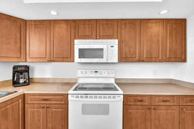 a view of a chairs and table in patio