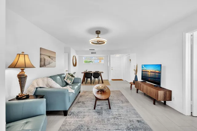 a living room with furniture and a table