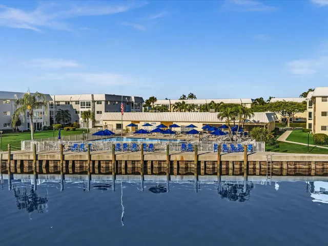 an aerial view of residential building and lake