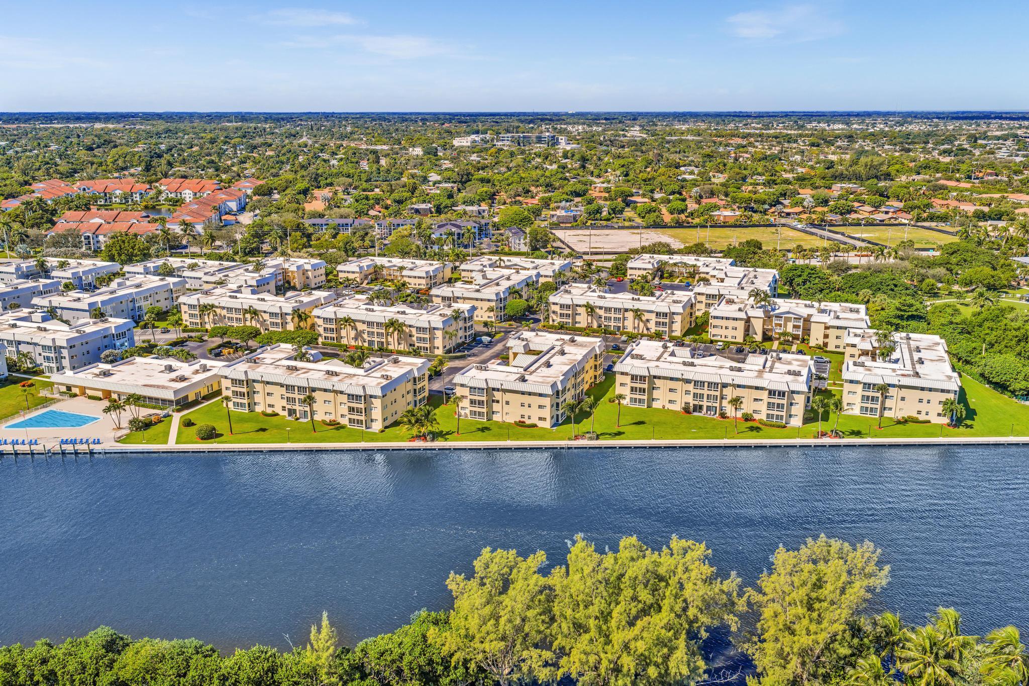 3 Colonial Club Drive, Unit 300 Boynton Beach, FL 33435 - Photo 41 of 71 an aerial view of residential building and lake