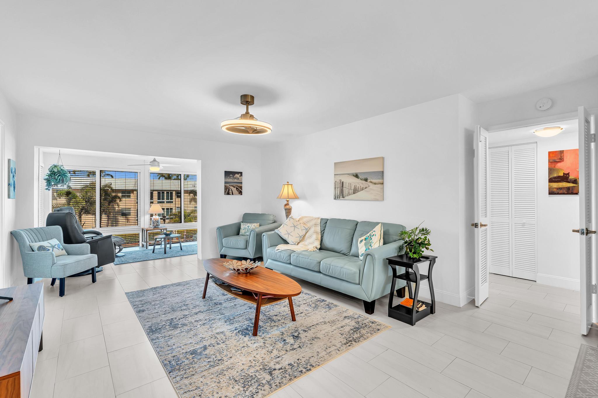 3 Colonial Club Drive, Unit 300 Boynton Beach, FL 33435 - Photo 5 of 71 a living room with furniture and a table