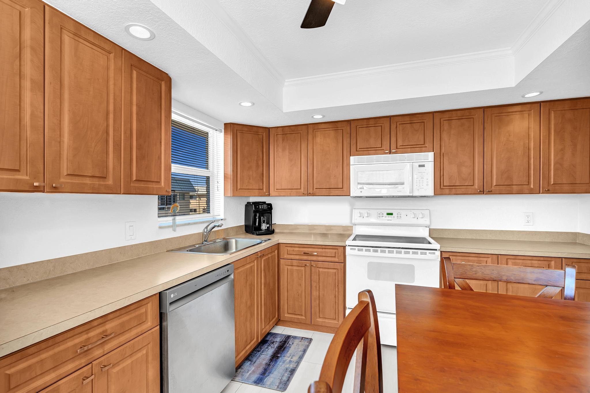 3 Colonial Club Drive, Unit 300 Boynton Beach, FL 33435 - Photo 8 of 71 a kitchen with a sink and cabinets