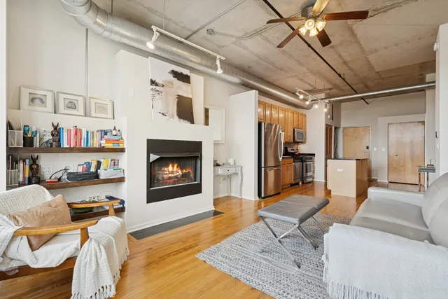 a living room with furniture and a fireplace