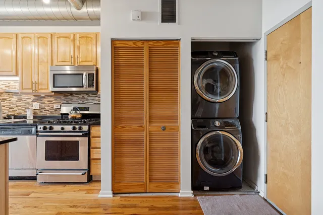 a view of a kitchen with washer and dryer