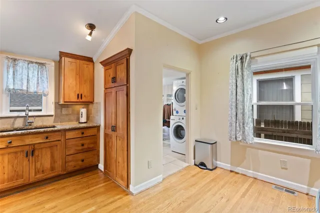 a view of a kitchen with a sink and a window
