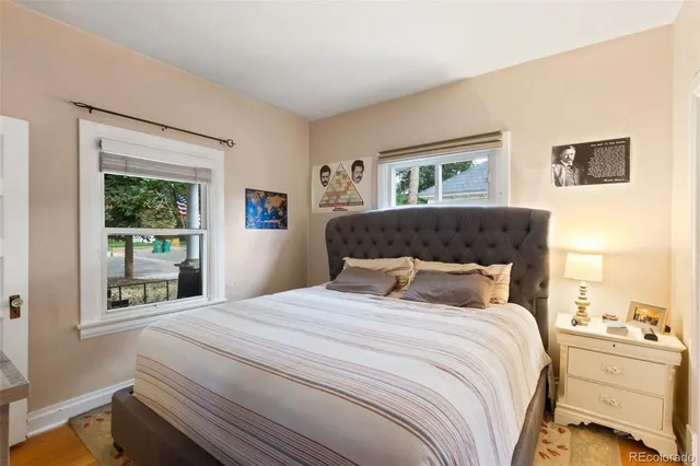 a bedroom with a large bed and a window