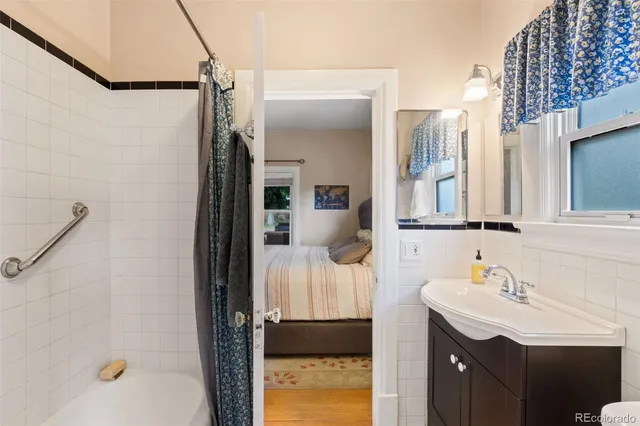 a bathroom with a sink vanity and a mirror