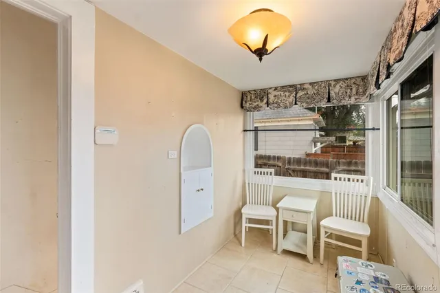 a room with chairs and table