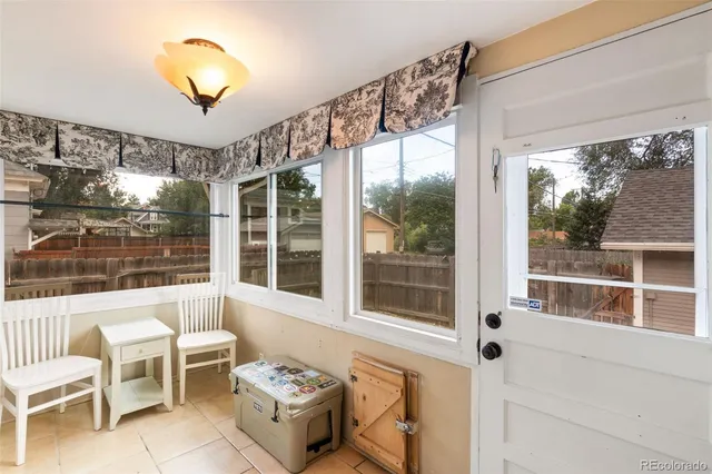 a living room with large windows