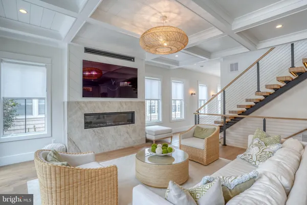 a view of a brick house with a swimming pool and a yard