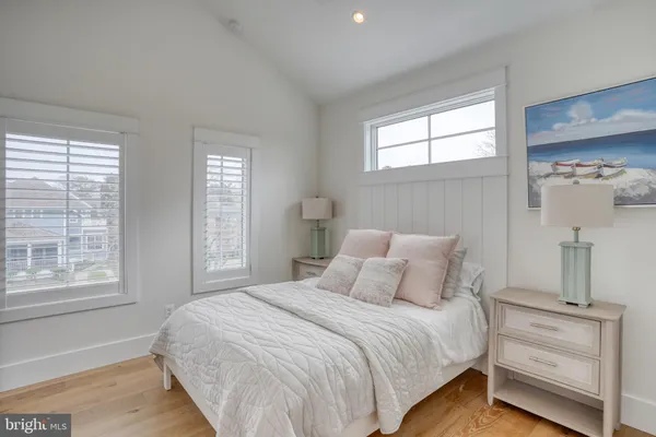 a kitchen with stainless steel appliances granite countertop a sink counter space and a large window