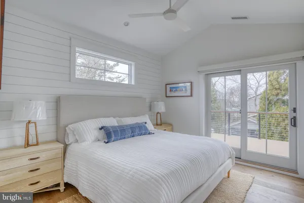 a bedroom with a bed and a mirror