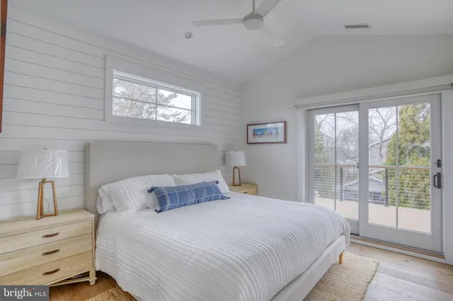 a bedroom with a bed and a mirror