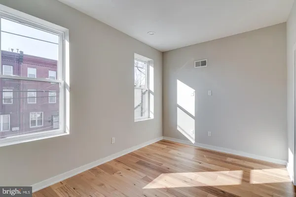 a view of hallway with wooden floor