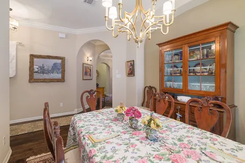 a bedroom with a bed a dresser and large mirror