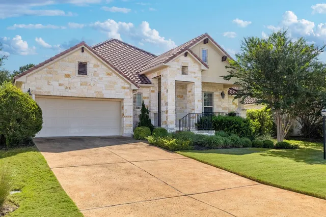 a front view of a house with yard