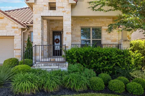 front view of a house with a garden