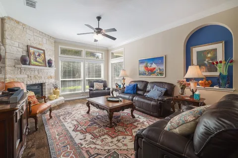 a living room with furniture and a fireplace