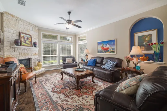 a living room with furniture and a fireplace