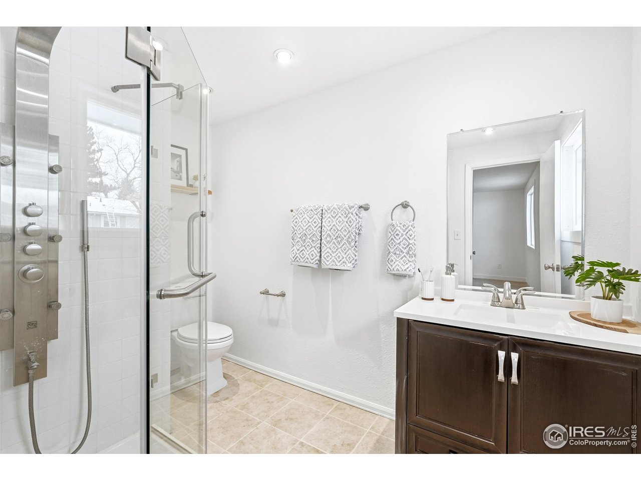 4559 Beachcomber Court Boulder, CO 80301 - Photo 12 of 22 a bathroom with a sink vanity granite toilet and a mirror