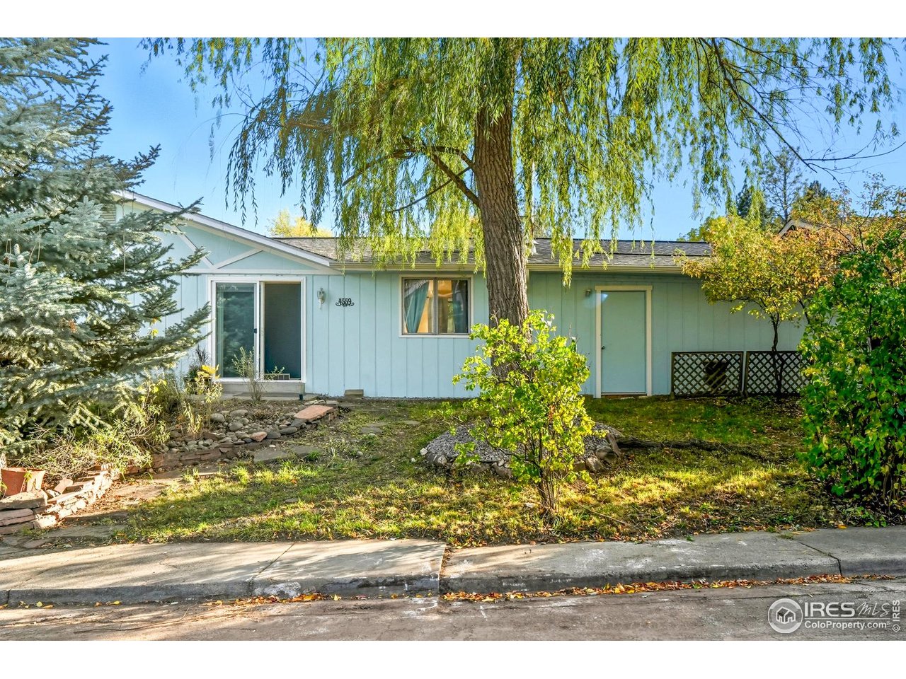 4559 Beachcomber Court Boulder, CO 80301 - Photo 16 of 22 a view of a house with a yard