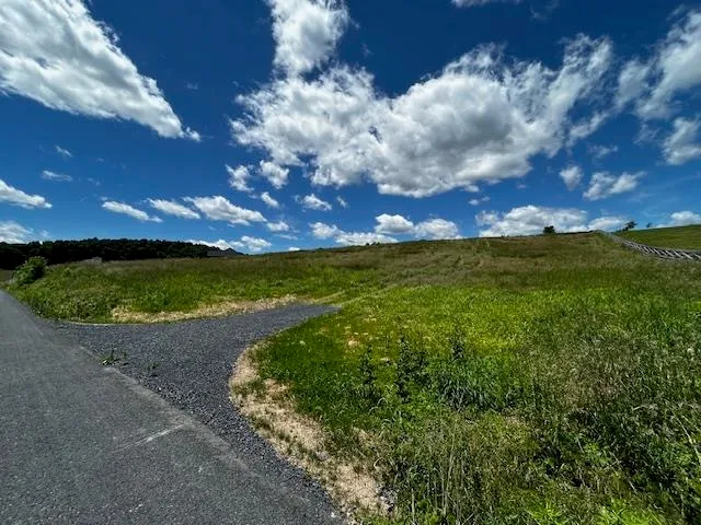 a view of a lake with sunset