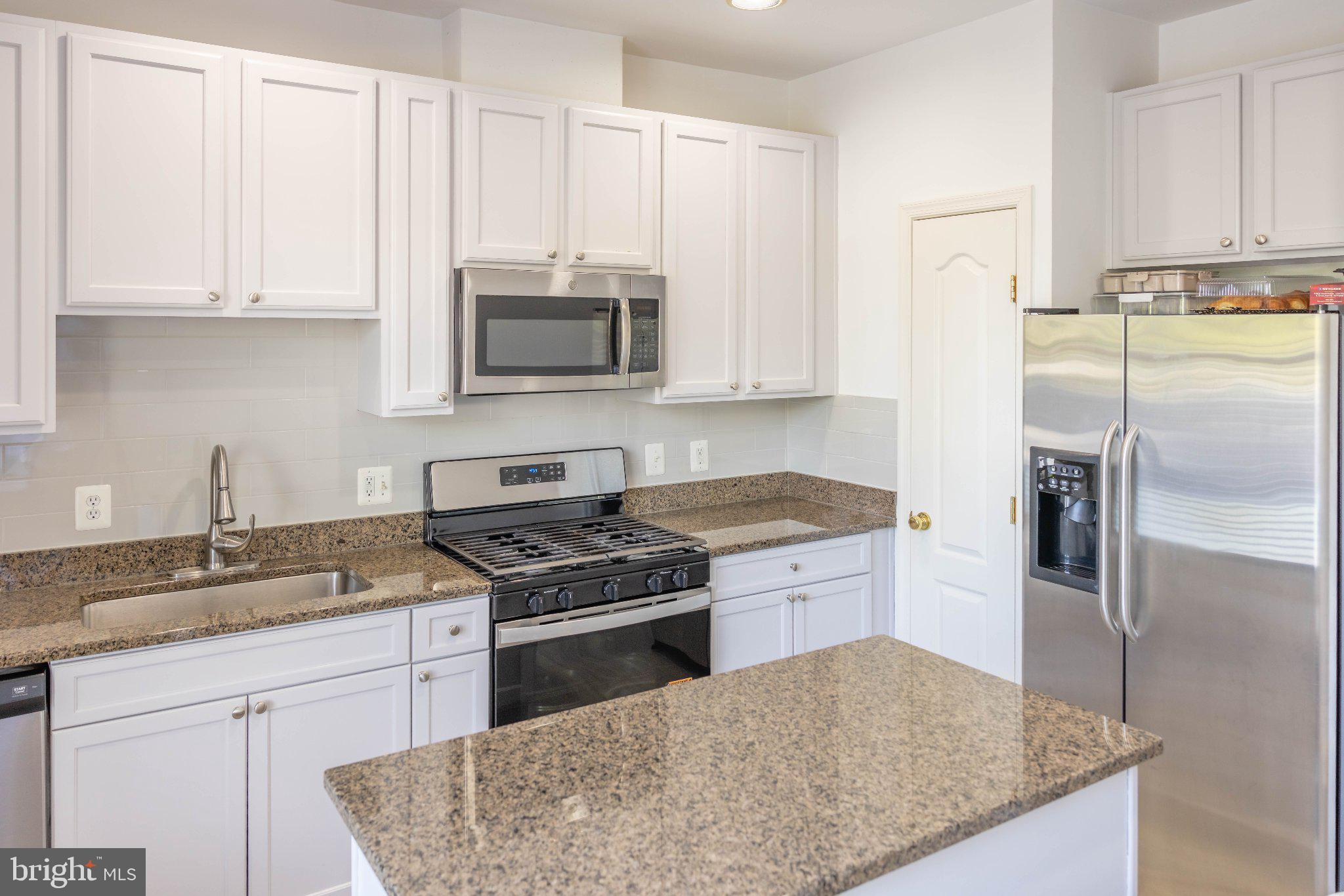 12824 Clarksburg Square Road, Unit 105 Clarksburg, MD 20871 - Photo 40 of 96 Modern kitchen with sleek finishes.