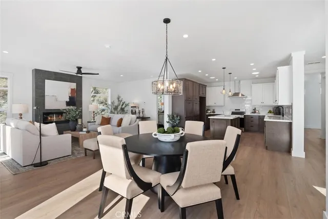 a kitchen with a sink a stove a refrigerator and cabinets