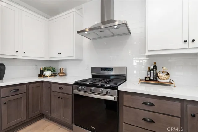 a kitchen with cabinets appliances and a sink