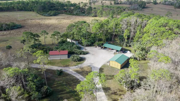a view of a swimming pool with a yard