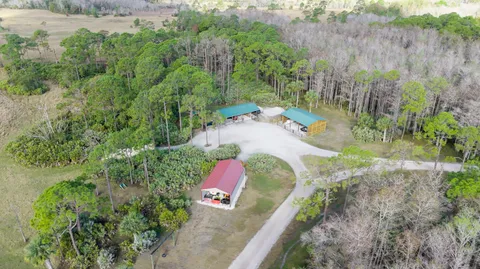 an aerial view of residential house with outdoor space