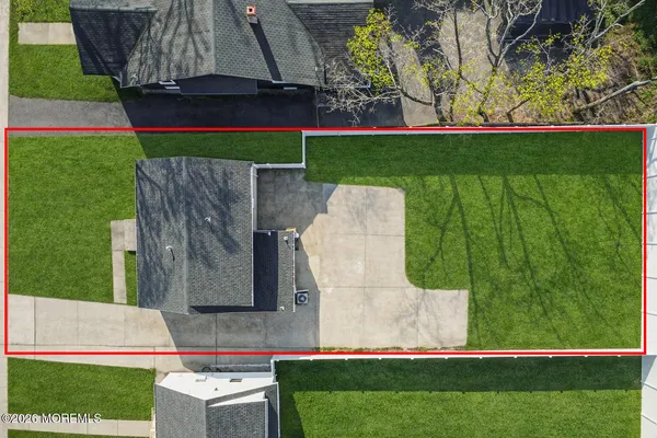 a view of house with backyard and entertaining space