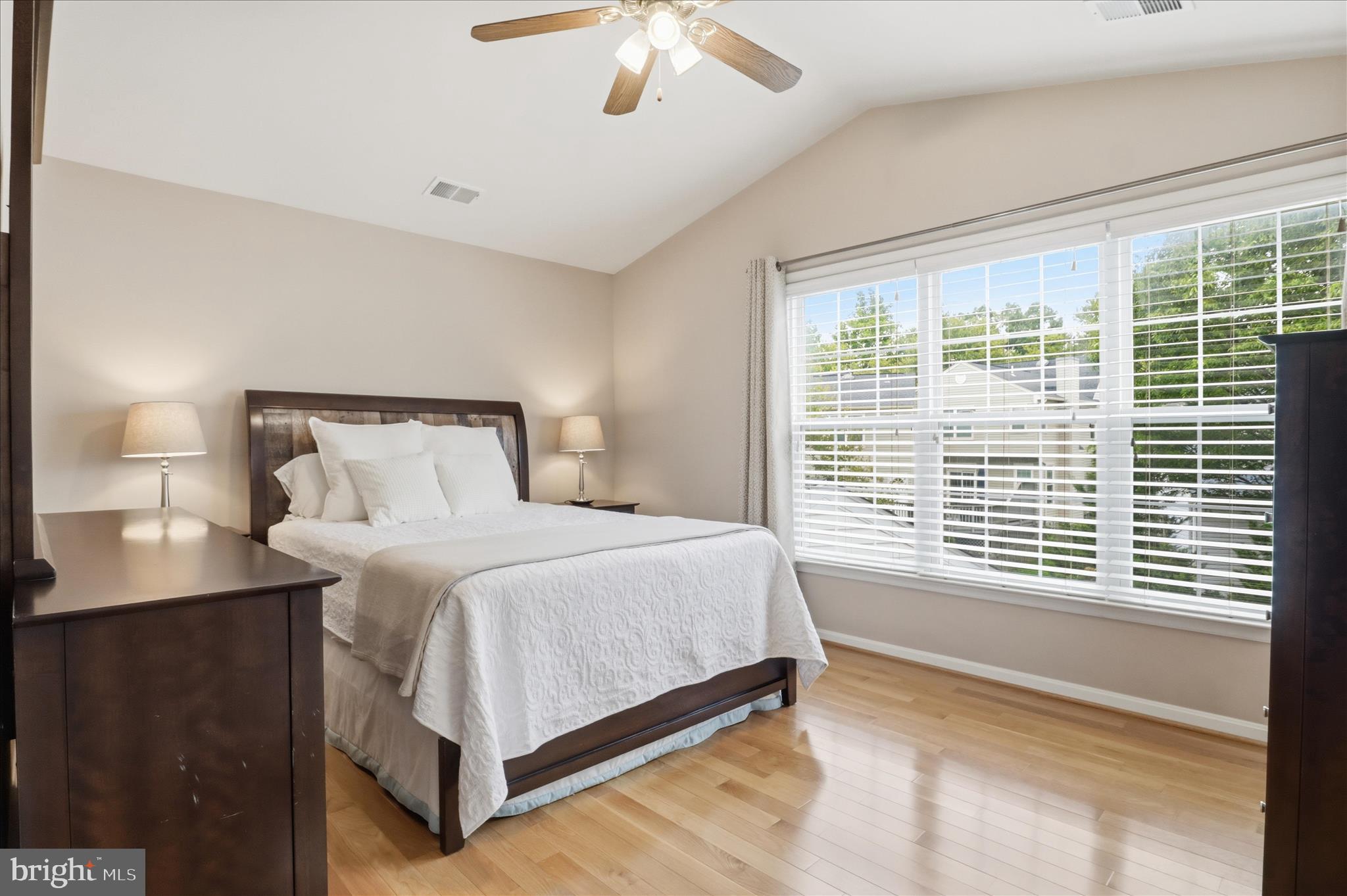 25352 Ripleys Field Drive Chantilly, VA 20152 - Photo 17 of 54 a bedroom with a large bed and a chandelier