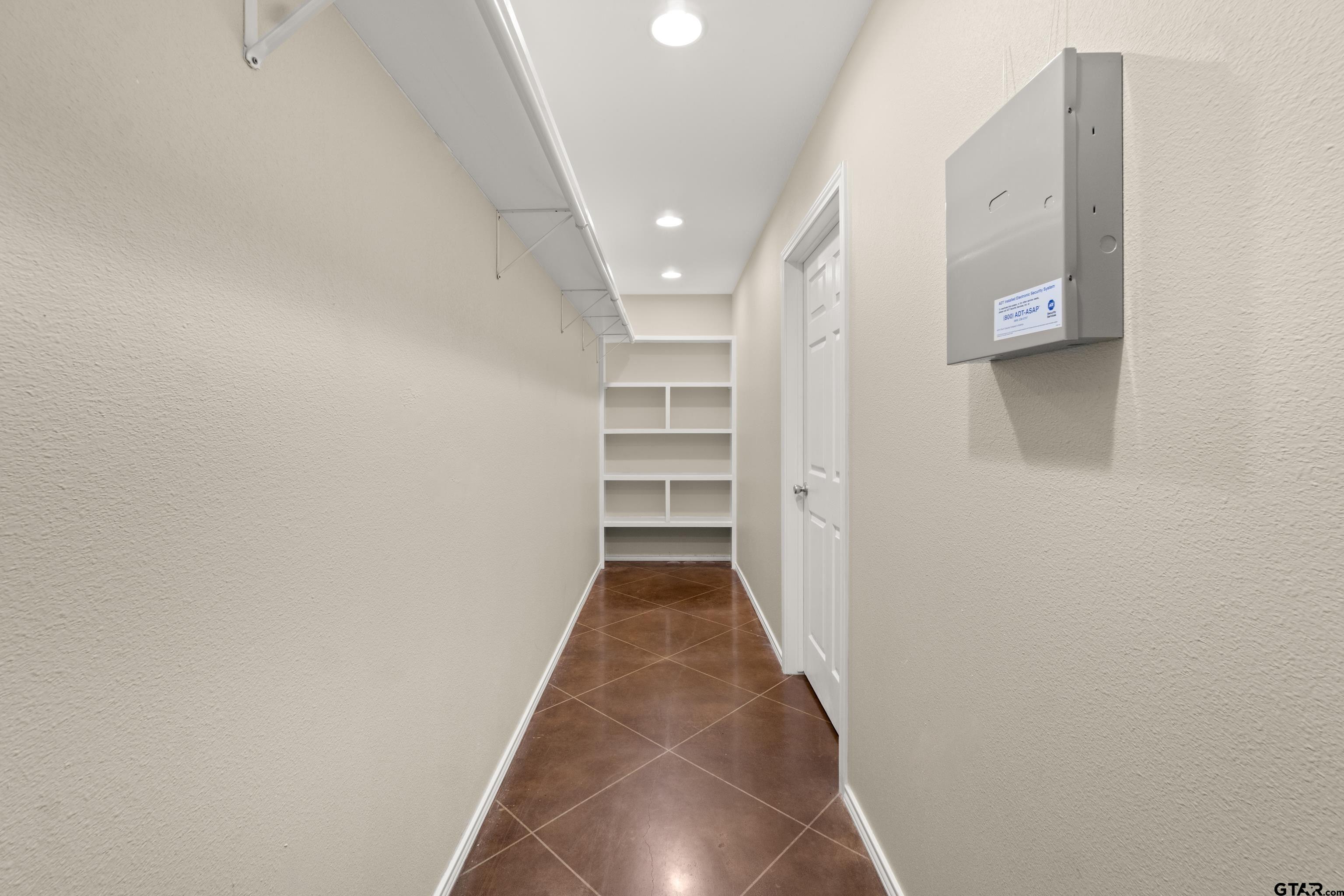 672 County Road 4960 Pittsburg, TX 75686 - Photo 18 of 26 a view of a hallway with wooden floor and closet