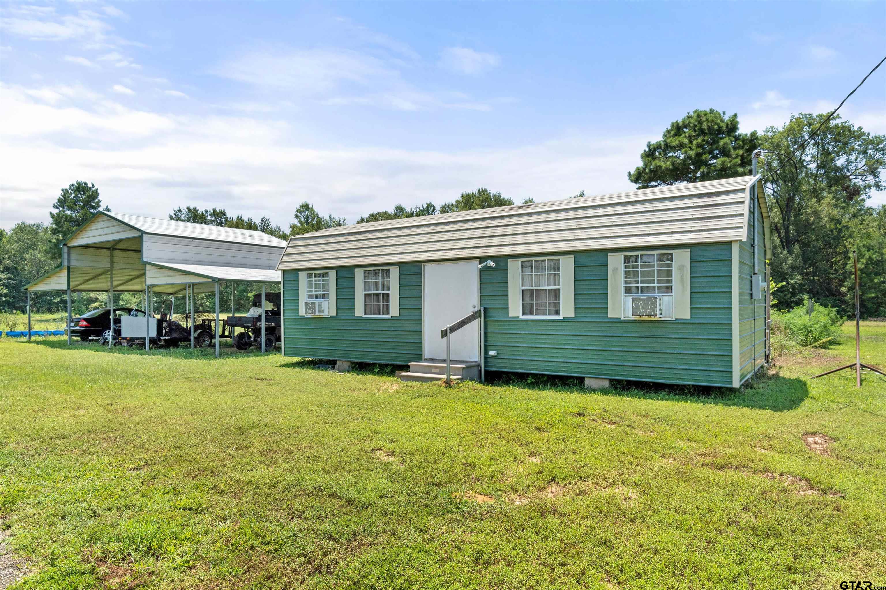 672 County Road 4960 Pittsburg, TX 75686 - Photo 26 of 26 a view of house with yard