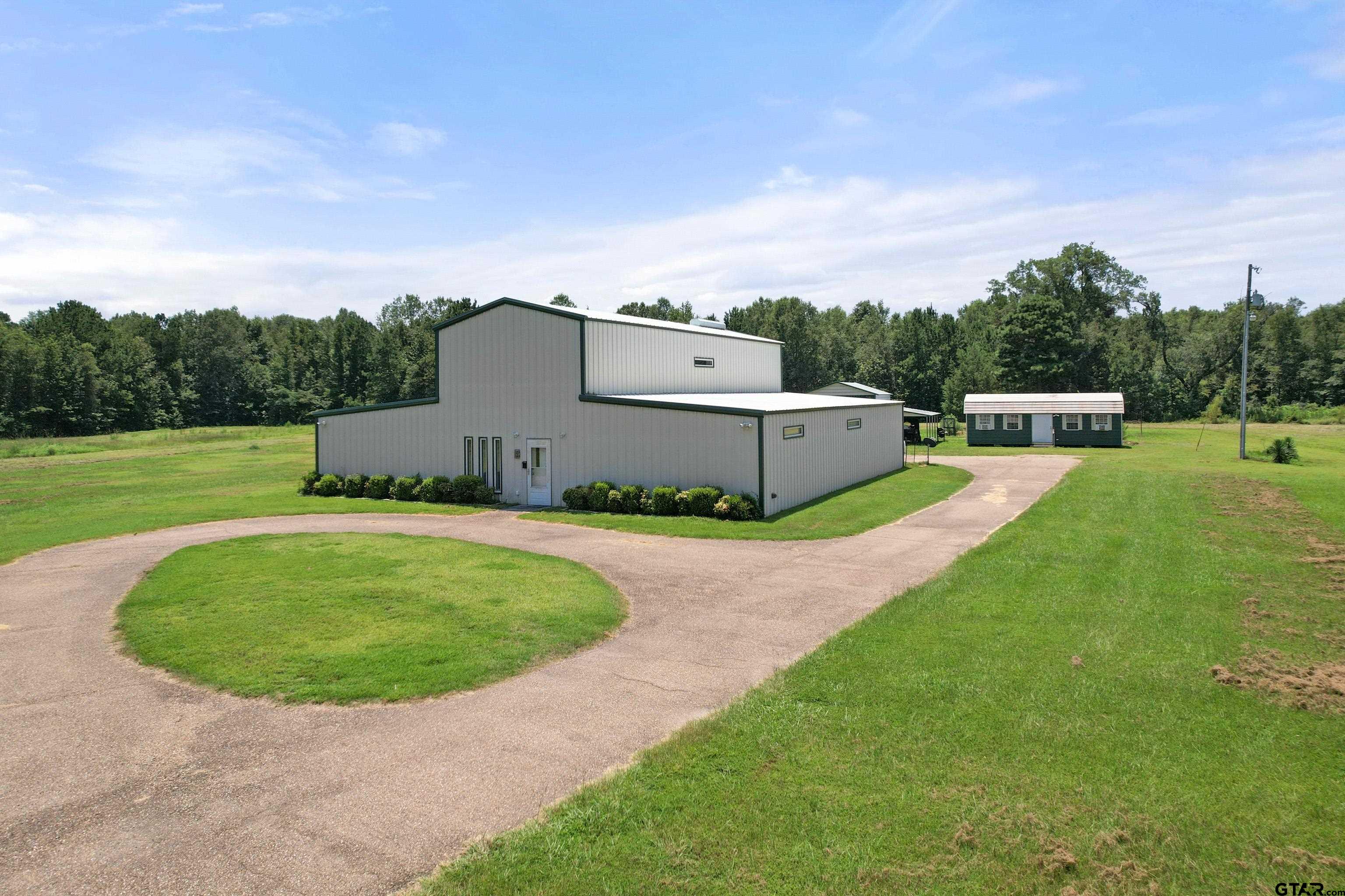672 County Road 4960 Pittsburg, TX 75686 - Photo 5 of 26 an aerial view of a house with outdoor space and trees all around