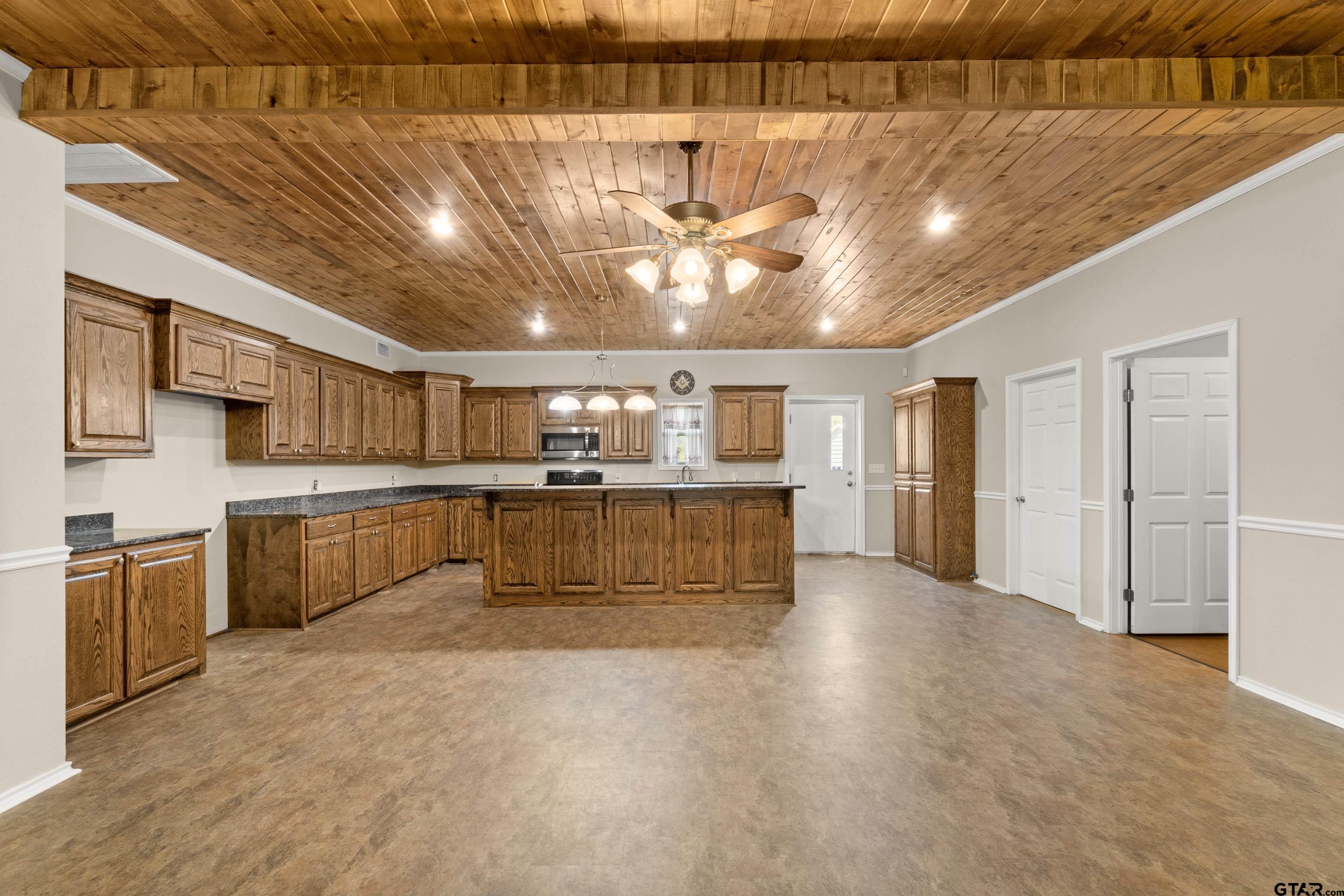 672 County Road 4960 Pittsburg, TX 75686 - Photo 8 of 26 a view of a kitchen with a sink and cabinets