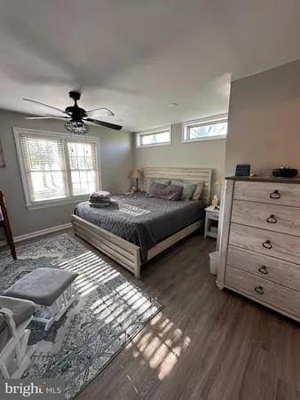 a spacious bedroom with a bed and window