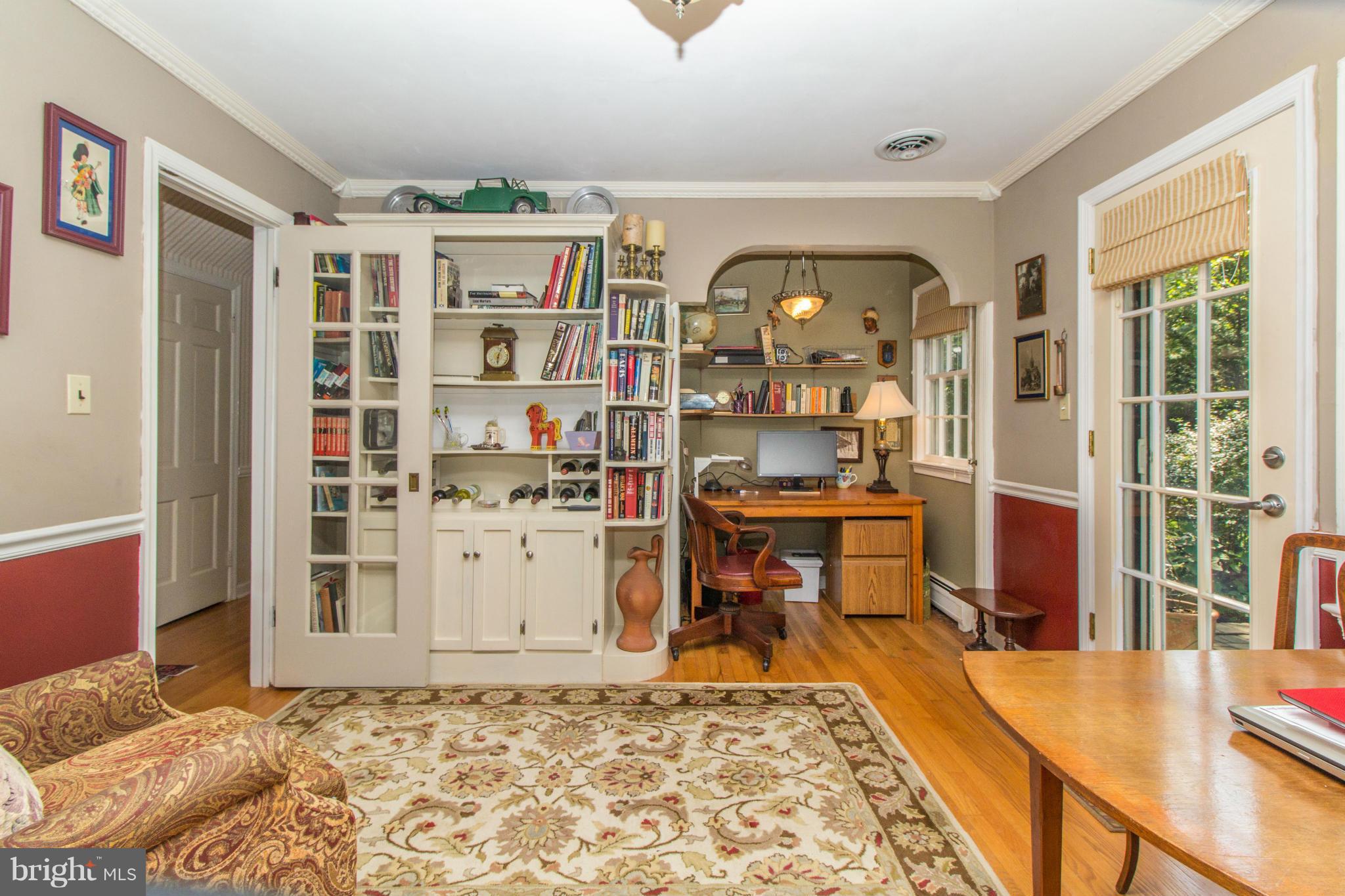 4221 Briars Road Olney, MD 20832 - Photo 14 of 30 a living room with fish tank and a rug
