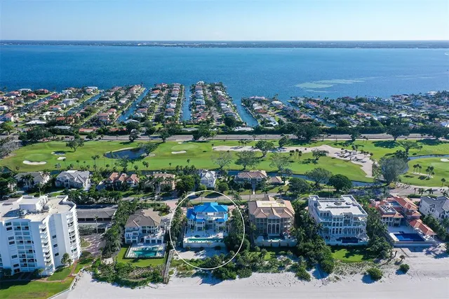 a view of a dining room with furniture and a chandelier