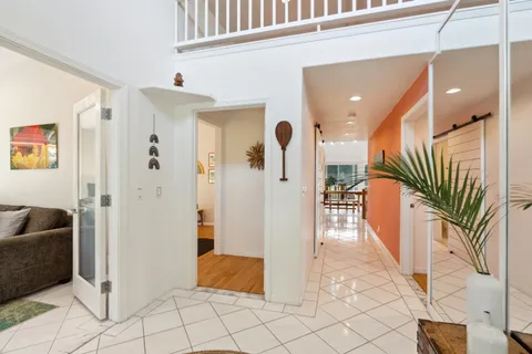 a view of entryway and hall with a rug
