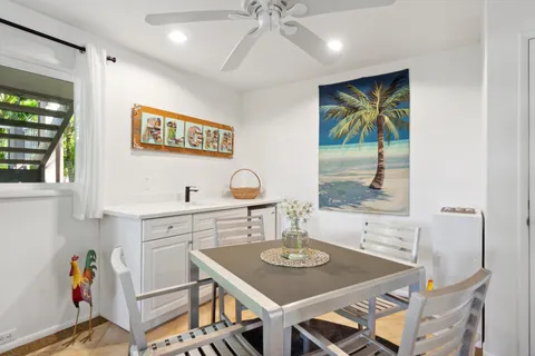 a view of a dining room with furniture and window