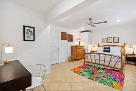 a living room with furniture and flat screen tv