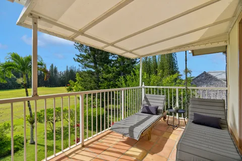 a view of balcony with furniture