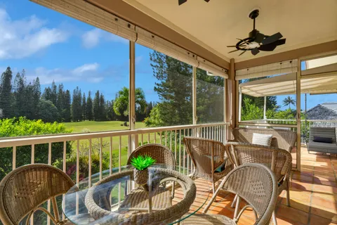 a view of a balcony with furniture