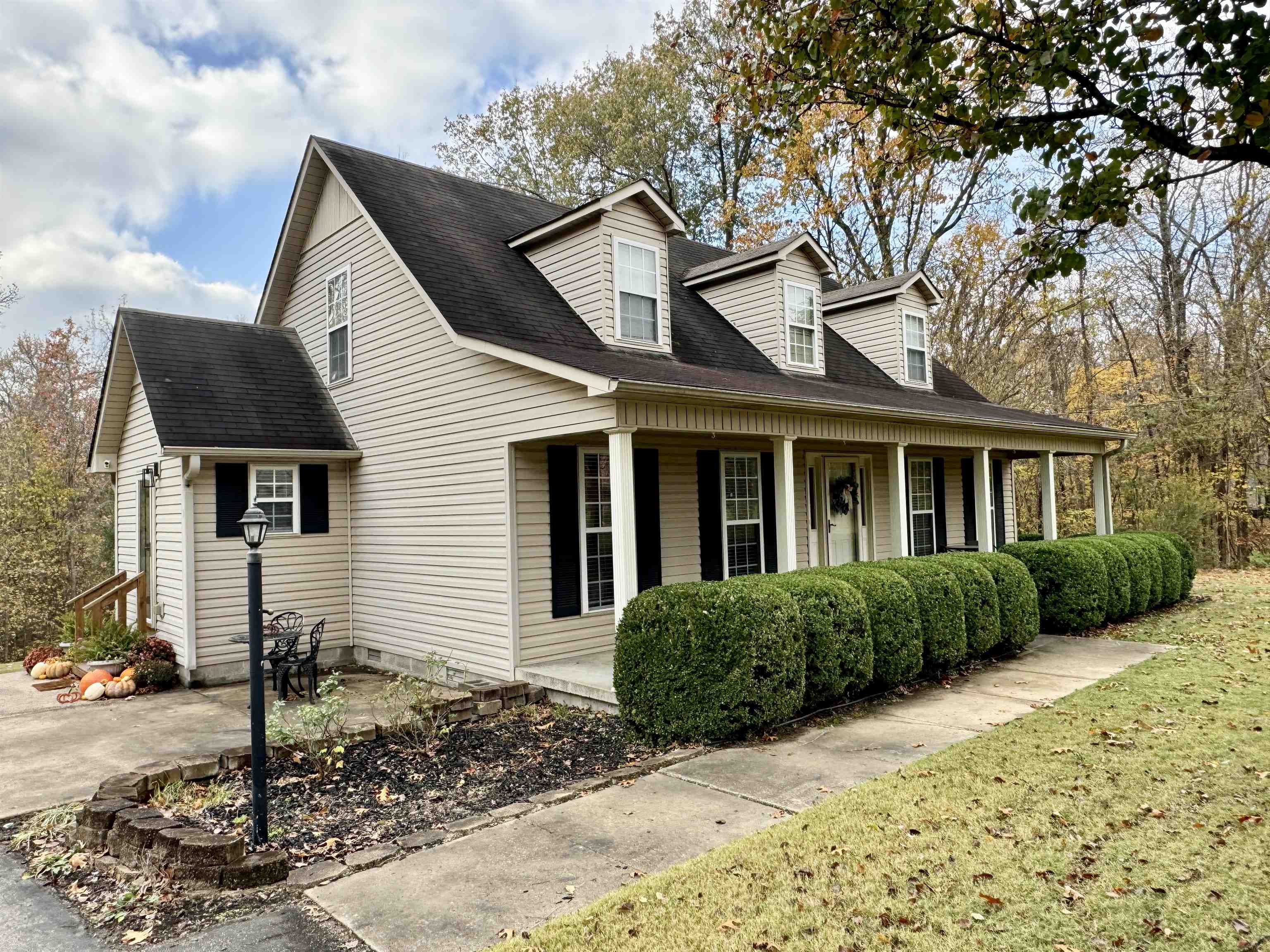 47 Chisholm Lake Road Ripley, TN 38063 - Photo 1 of 26 a front view of a house with a garden