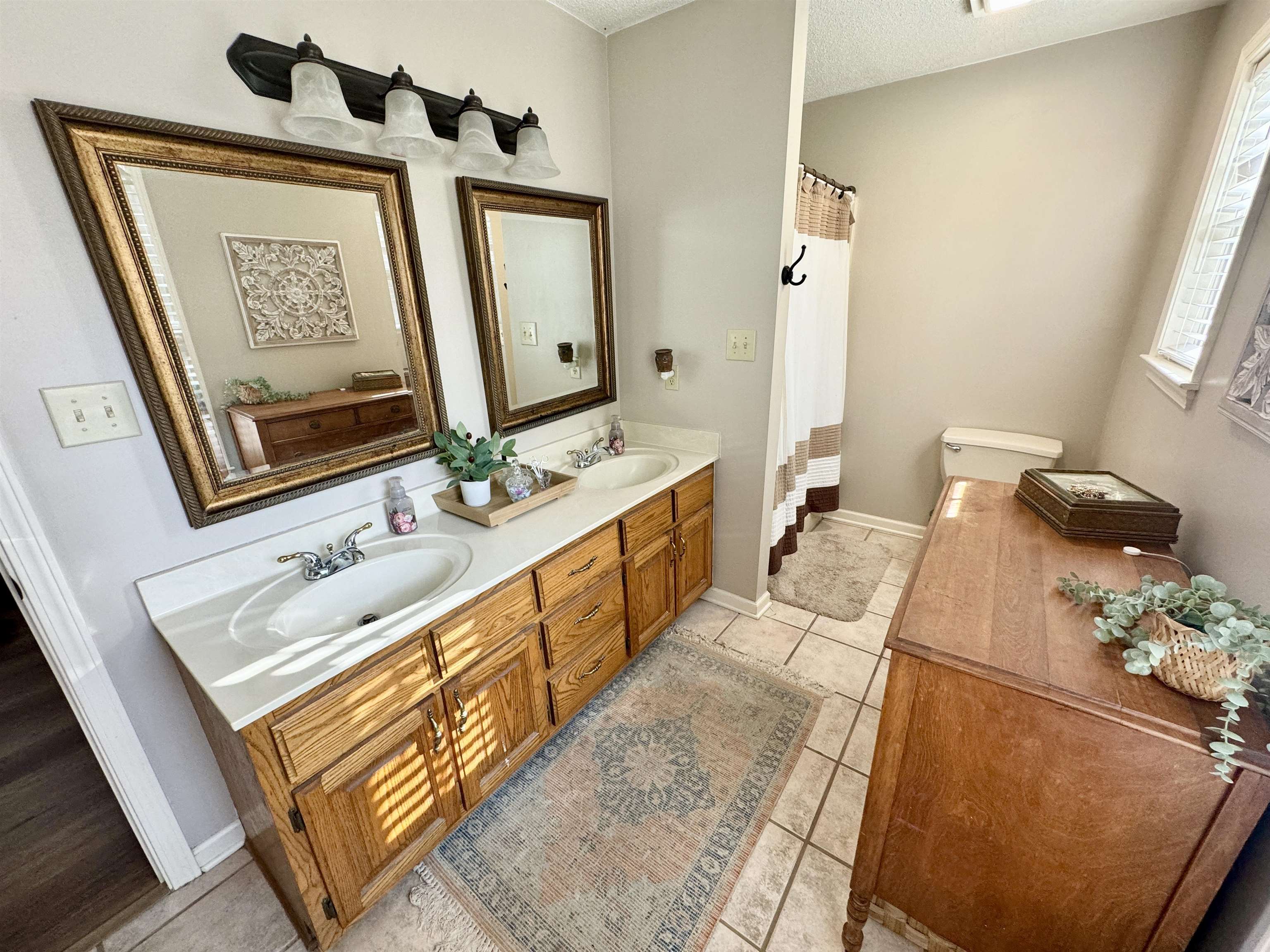 47 Chisholm Lake Road Ripley, TN 38063 - Photo 14 of 26 a bathroom with 2 sink and mirror